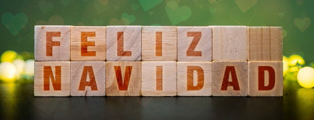Feliz Navidad spelled out on wooden blocks, a festive holiday greeting for Christmas celebrations