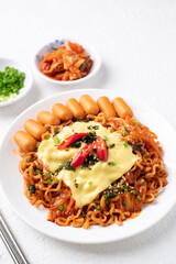 Korean spicy instant noodles with kimchi, sausage and Mozzarella cheese