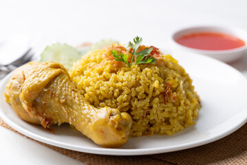 Thai Biryani rice with chicken and chili sauce on white background