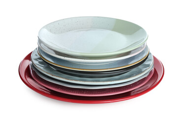 Stack of colorful ceramic plates isolated on white