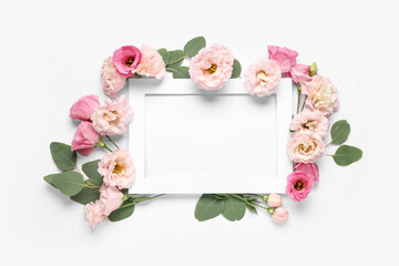 Paper frame with beautiful flowers on white background