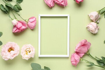 Paper frame with beautiful flowers on green background