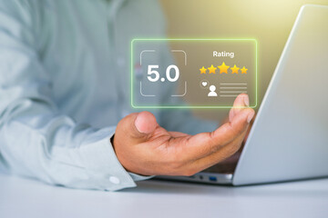 Customer satisfaction. five-star rating. online feedback. digital review system. positive business reputation. businessman holding holographic rating for e-commerce marketing quality improvement
