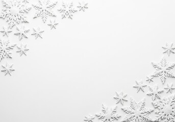 Decorative white snowflakes on a clean white background for winter holiday designs