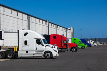 Semi trucks parked on warehouse loading dock