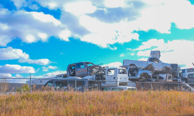 Scarped cars at a vehicle junk scrapyard