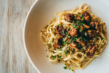 Pasta with meat sauce in a white bowl