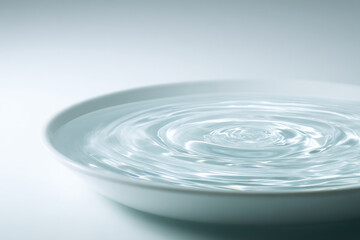 Close up of gentle ripples in bowl of purified water, soft natural lighting creates calm and serene atmosphere, emphasizing clarity and tranquility