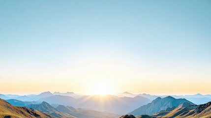 Fototapeta premium Sunrise over mountain range with clear sky and soft light illuminating landscape