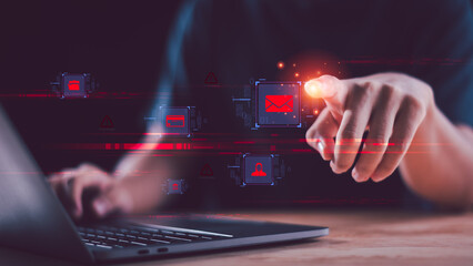 Hand touching glowing digital mail icon on screen with cybersecurity warning symbols, representing phishing attack, data breach, malware threat, online fraud prevention for secure email communication