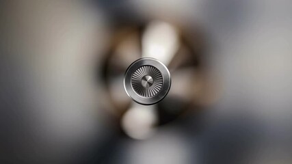 Close-up, top-down view of a metal object with a textured surface and a blurred background, highlighting intricate details and reflections, suitable for design and technology themes