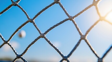 Protective Netting at Stadiums Preventing Balls from Hitting Spectators Beneath Bright Blue Sky