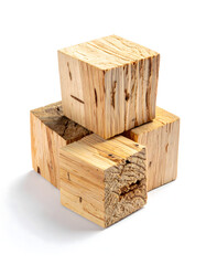 A cluster of dry, tinder material (e.g., birch bark or fire log cubes) arranged neatly, isolated
