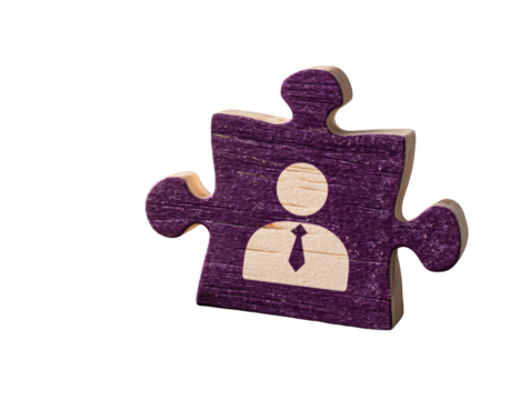 A puzzle piece with a man wearing a tie on it