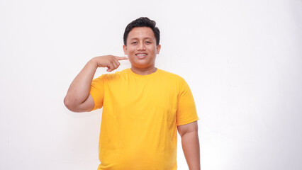 Young Asian fat men gesturing sign language on isolated background