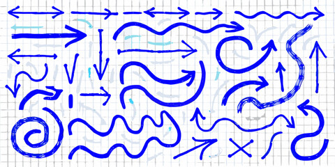 Collection of hand drawn blue arrows and wavy lines on a grid background