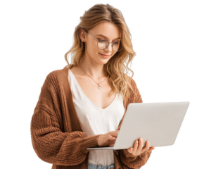 A woman wearing glasses and a brown sweater is sitting in front of a laptop