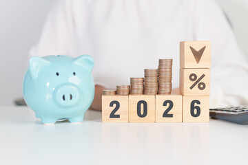 2026 New year with percentage change to UP and Down arrow with coin stack. Interest rate, GDP, stocks market, financial, deflation and Inflation, mortgage, debt, Loan and Economic Recession