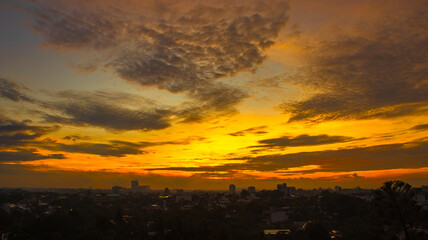 Sunrise colors painting the sky in tranquil tones.