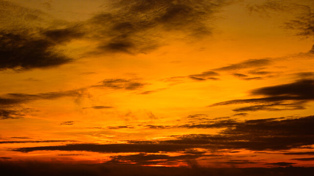 Sunrise colors painting the sky in tranquil tones.