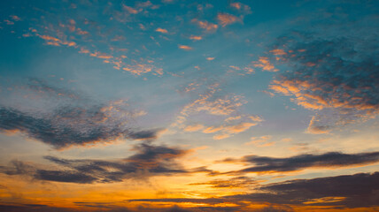 Sunrise colors painting the sky in tranquil tones.