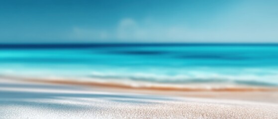 Blurry beach scene with ocean and sand