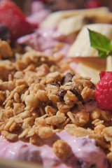 Delicious granola bowl with fresh fruits on a sunny day