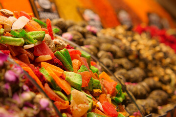 Colorful display of dried fruits and spices at market