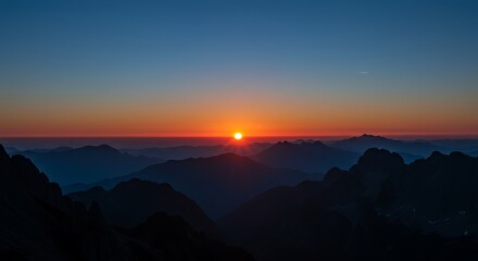 Sunrise Over Mountain Range With Hazy Valleys.