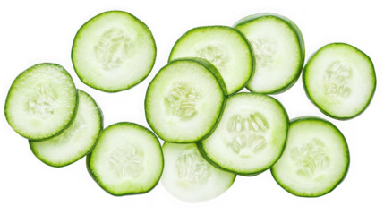 A top down view of several cucumber slices  showing the seeds and green skin edge on transparent background