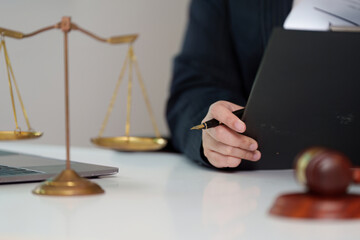 Lawyer Holding Document with Scales of Justice