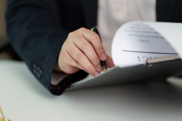 Close-Up of Lawyer Signing Document