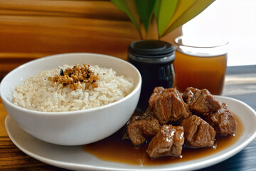 Filipino dish of savory fried rice cooked with tender pieces of meat, offering a comforting and flavorful everyday meal.