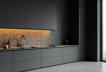 Sleek matte grey kitchen with under-cabinet lighting, minimalist style, concrete wall and floor, daylight from large window, concept of modern home. 3D Rendering