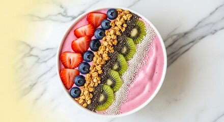 A vibrant and healthy smoothie bowl topped with fresh berries, chia seeds, and sliced kiwi, arranged artfully