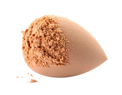 A makeup sponge with a textured surface, partially covered in powder, showcasing its shape and material.