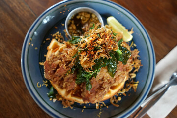 Close up deep fried chicken on waffle