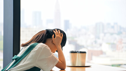 A restaurant employee worried inside the store