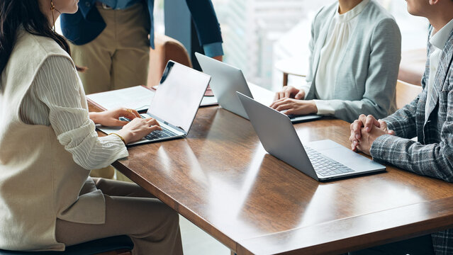 Group of casual business people meeting in an office