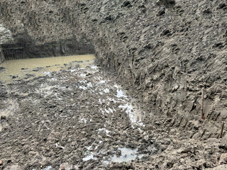 Muddy Excavation Pit at Construction Site