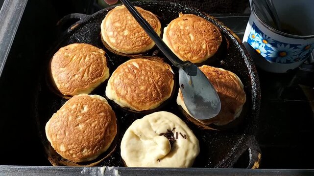 Close up shot of making Kamir. Kamir basically is a bread that almost similar to pancake from Pemalang, Central Java, Indonesia. 