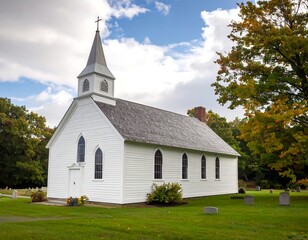 Traditional small white church with a steeple, set in autumn landscape