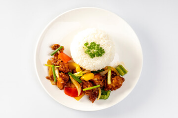 Crispy fried chicken with sweet and sour sauce on rice