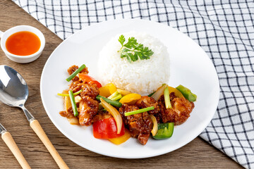 Crispy fried chicken with sweet and sour sauce on rice
