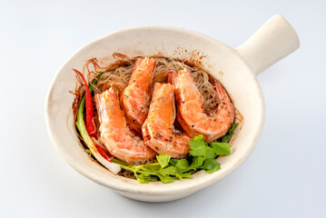 Baked shrimp with glass noodles on a white background