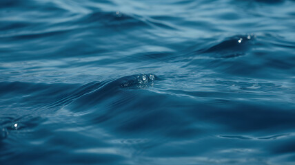 Fototapeta premium Close up of deep blue ocean waves with subtle ripples