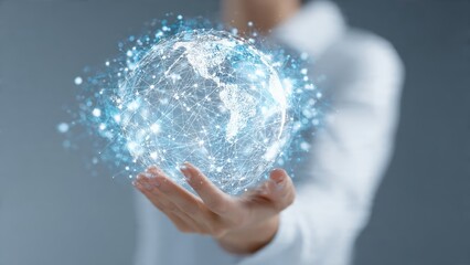 A person holds a glowing, digital representation of the Earth, symbolizing connectivity and technology in a futuristic context.
