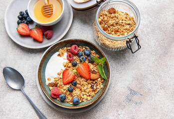 Granola bowl with yogurt berries and honey