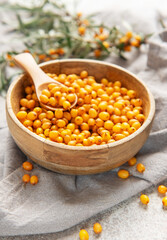 Sea buckthorn berries in wooden bowl