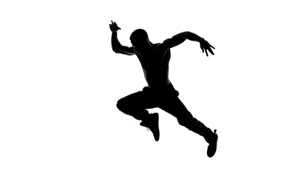 Obraz premium Silhouette of a person mid-stride, appearing to run or dance.